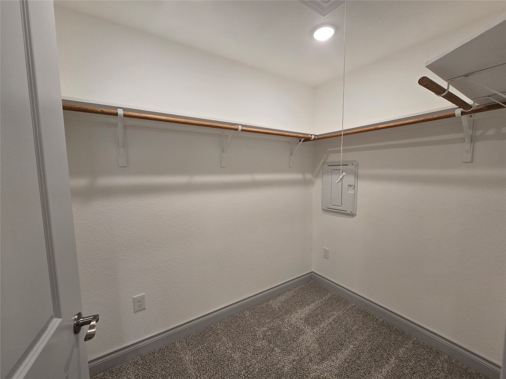 2105 Tiger Trail, Unit 702 Round Rock, TX 78664 - Photo 19 of 22 a view of an empty walk in closet