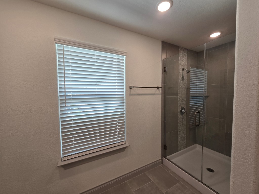 2105 Tiger Trail, Unit 702 Round Rock, TX 78664 - Photo 9 of 22 a bathroom with a shower and a sink