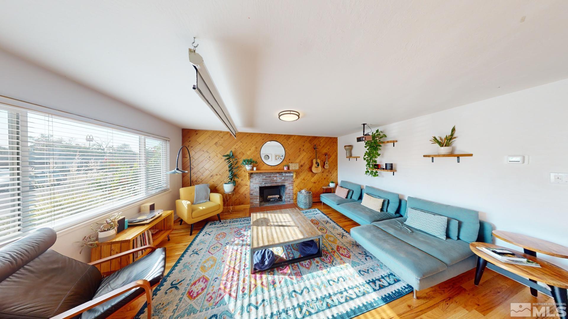 945 Cordone Avenue Reno, NV 89502 - Photo 12 of 33 a living room with furniture and a large window