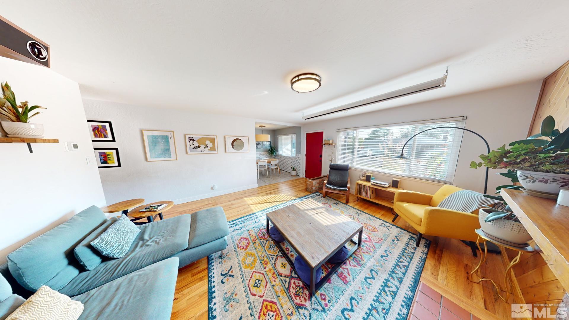 945 Cordone Avenue Reno, NV 89502 - Photo 13 of 33 a living room with furniture and a flat screen tv