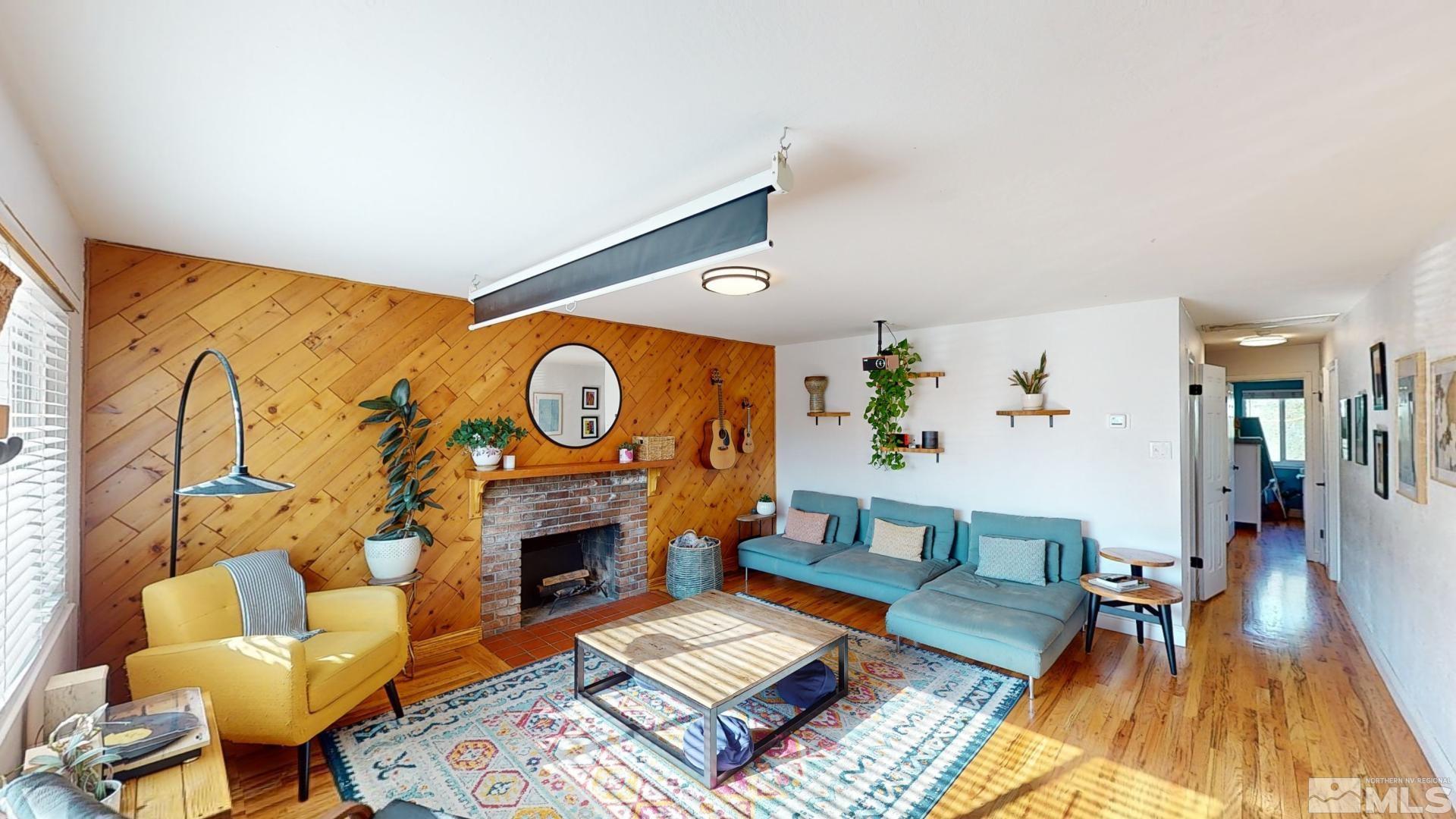 945 Cordone Avenue Reno, NV 89502 - Photo 14 of 33 a living room with furniture and a fireplace