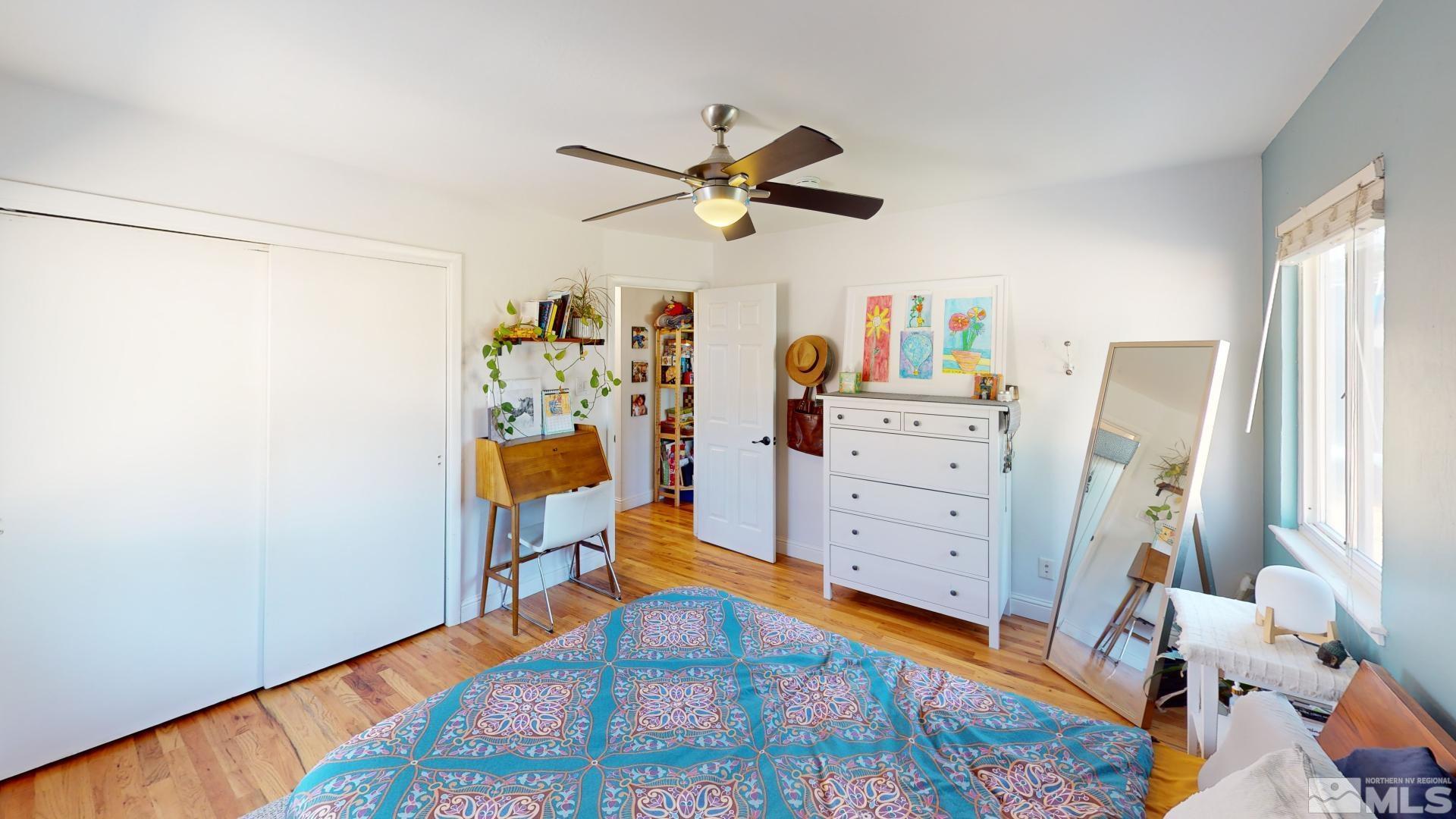 945 Cordone Avenue Reno, NV 89502 - Photo 16 of 33 a bedroom with a bed and wooden floor