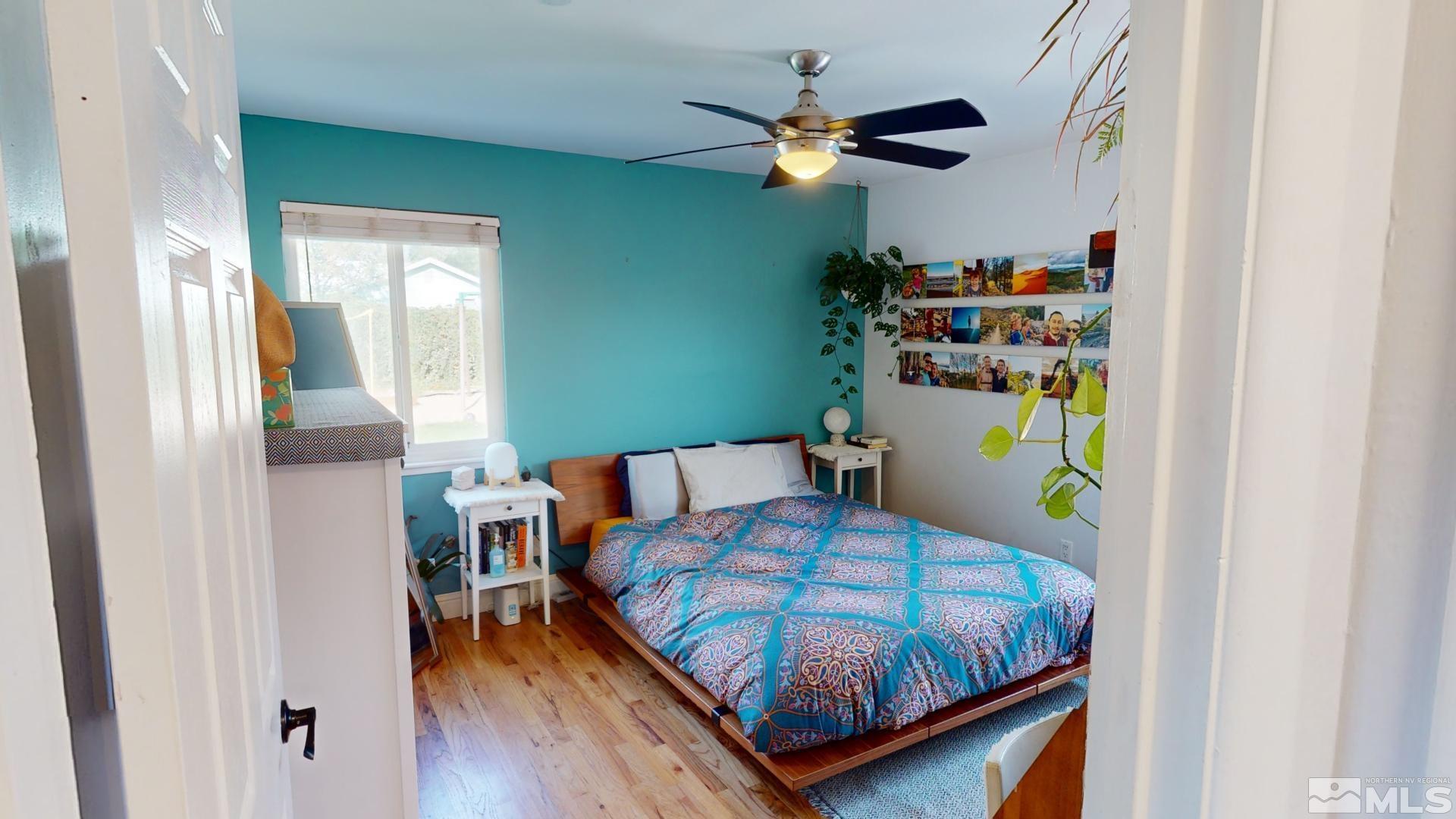 945 Cordone Avenue Reno, NV 89502 - Photo 17 of 33 a bedroom with a bed and a chandelier