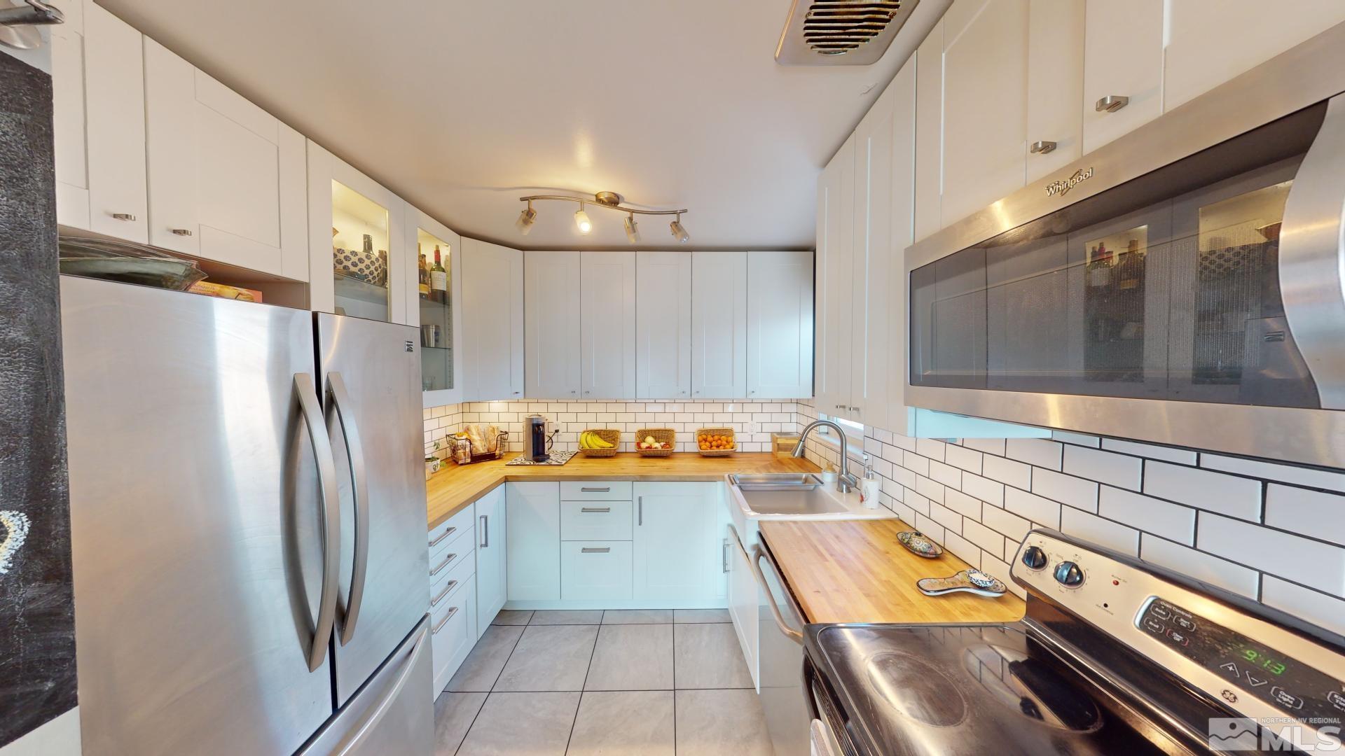 945 Cordone Avenue Reno, NV 89502 - Photo 26 of 33 a kitchen with a refrigerator and a sink