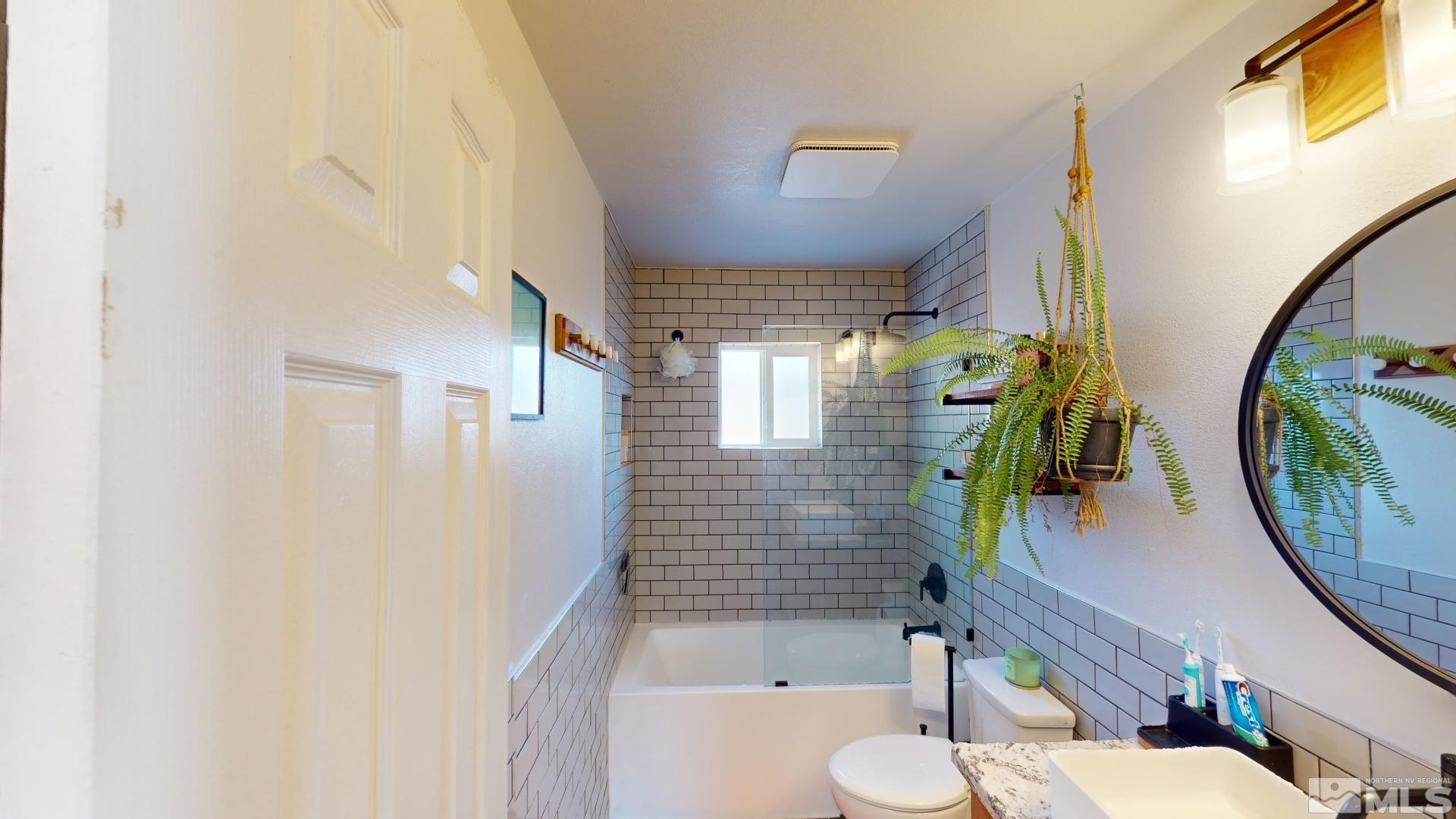945 Cordone Avenue Reno, NV 89502 - Photo 28 of 33 a bathroom with a sink a toilet and a mirror