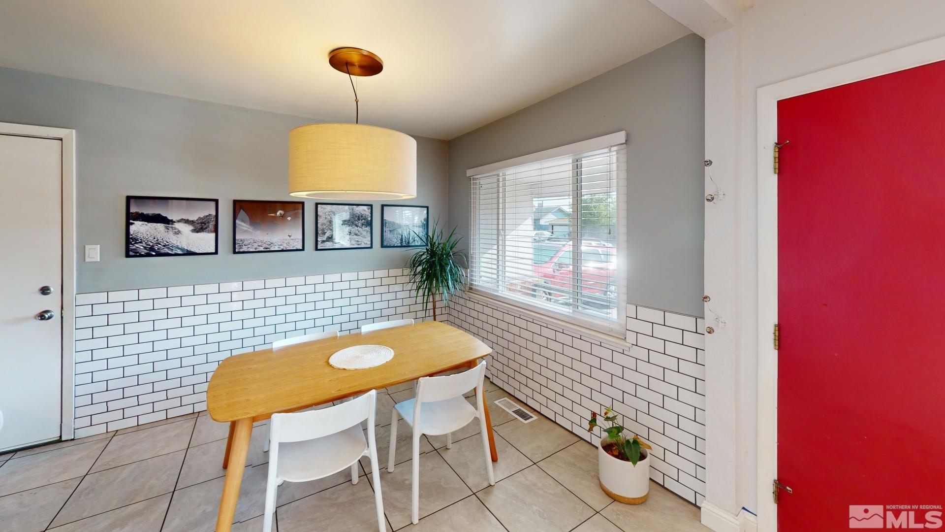 945 Cordone Avenue Reno, NV 89502 - Photo 6 of 33 a view of a dining room with furniture and wooden floor