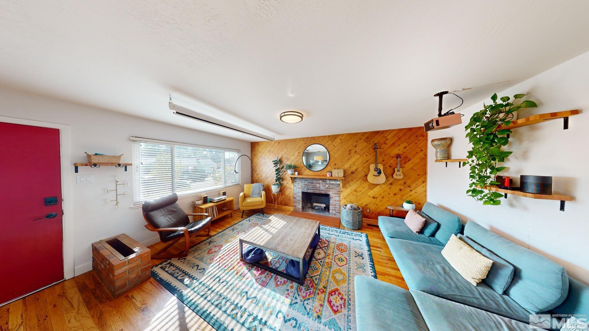 945 Cordone Avenue Reno, NV 89502 - Photo 10 of 33 a living room with furniture and a large window