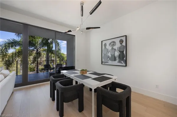 a view of a dining room with furniture window and outside view