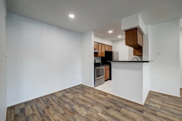 a view of a kitchen with microwave and cabinets