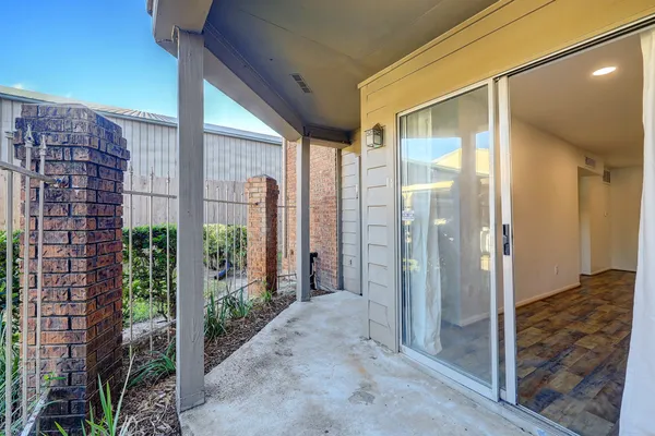 a view of a bathroom with a shower and a sink