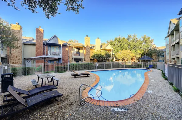 a view of a swimming pool with lounge chair