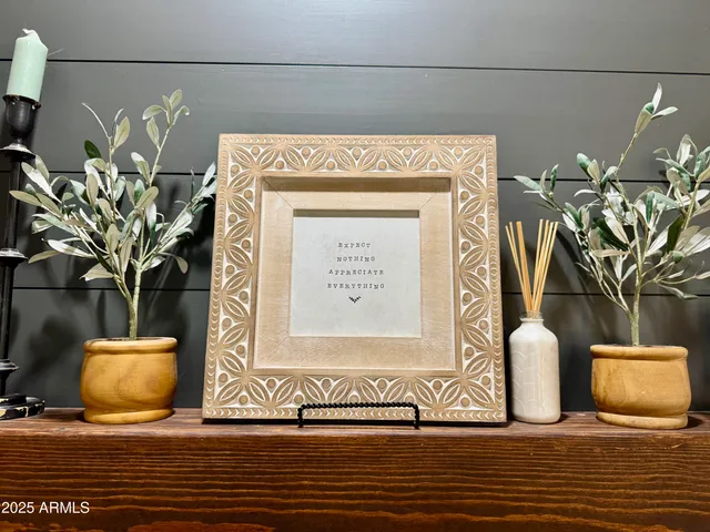 a white toilet sitting next to a white wall