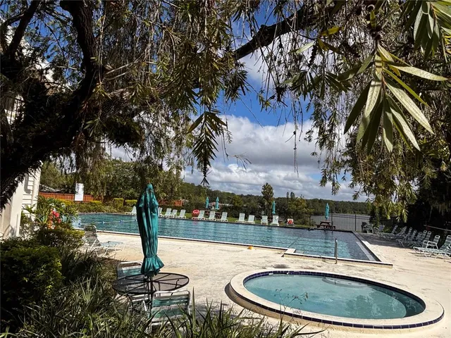 a view of a large white building with a city view