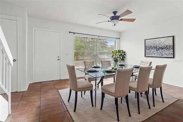 a view of a dining room with furniture and window