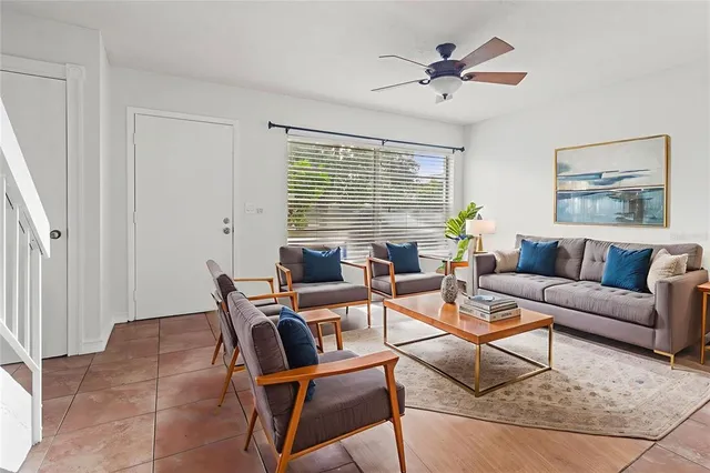 a living room with furniture and a window