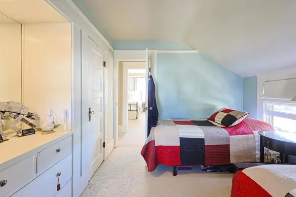 a bedroom with a bed and a closet