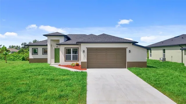 a front view of house with yard and green space