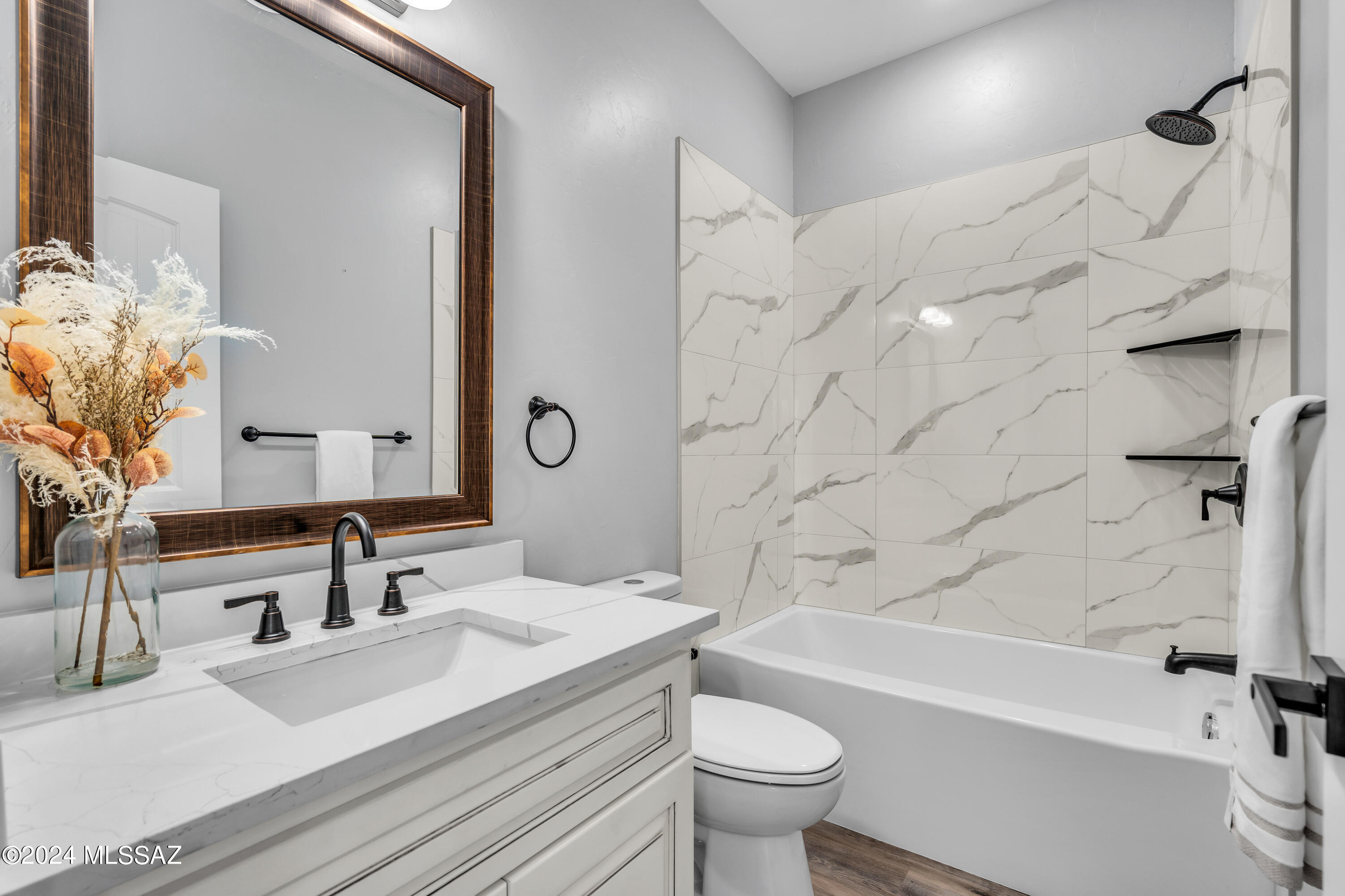 1849 Circulo Mexicali Rio Rico, AZ 85648 - Photo 15 of 29 a bathroom with a sink a toilet and a bathtub