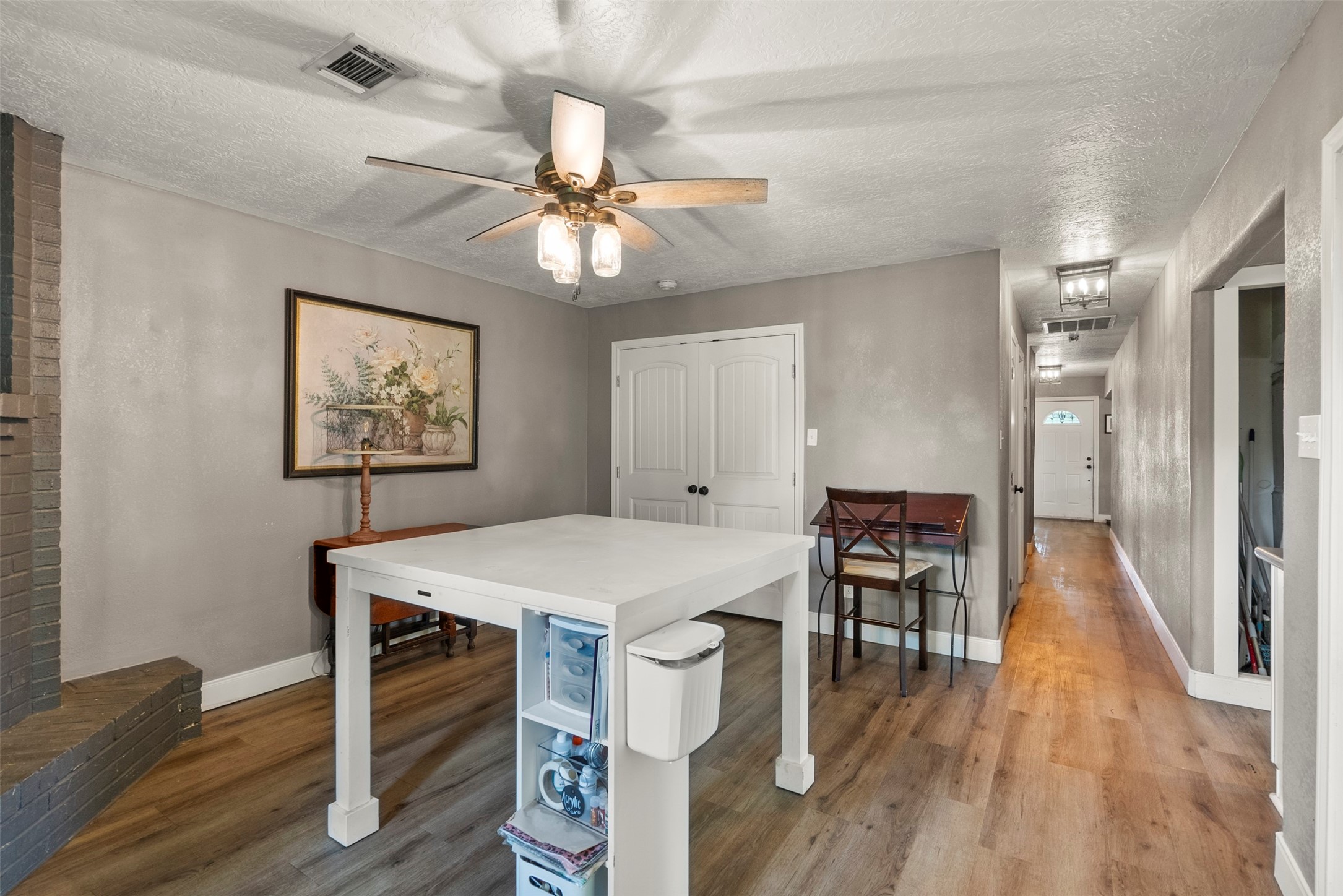 5211 Ghinaudo Road Hitchcock, TX 77563 - Photo 16 of 34 a view of a dining room with furniture wooden floor and chandelier