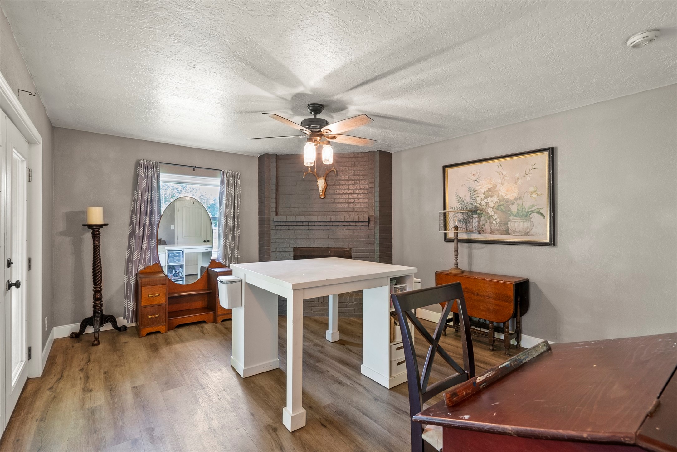 5211 Ghinaudo Road Hitchcock, TX 77563 - Photo 17 of 34 a view of a workspace with furniture and a window