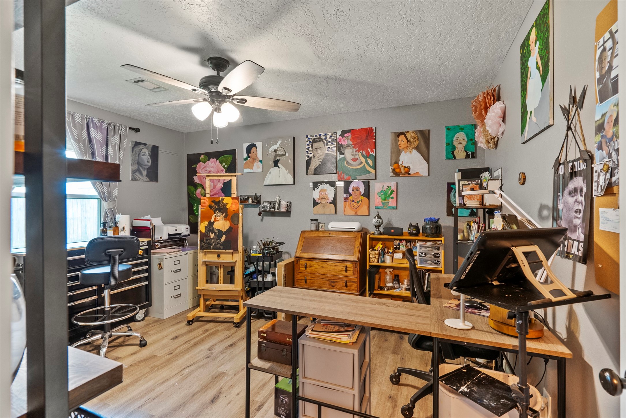 5211 Ghinaudo Road Hitchcock, TX 77563 - Photo 21 of 34 a view of a workspace with furniture and a window
