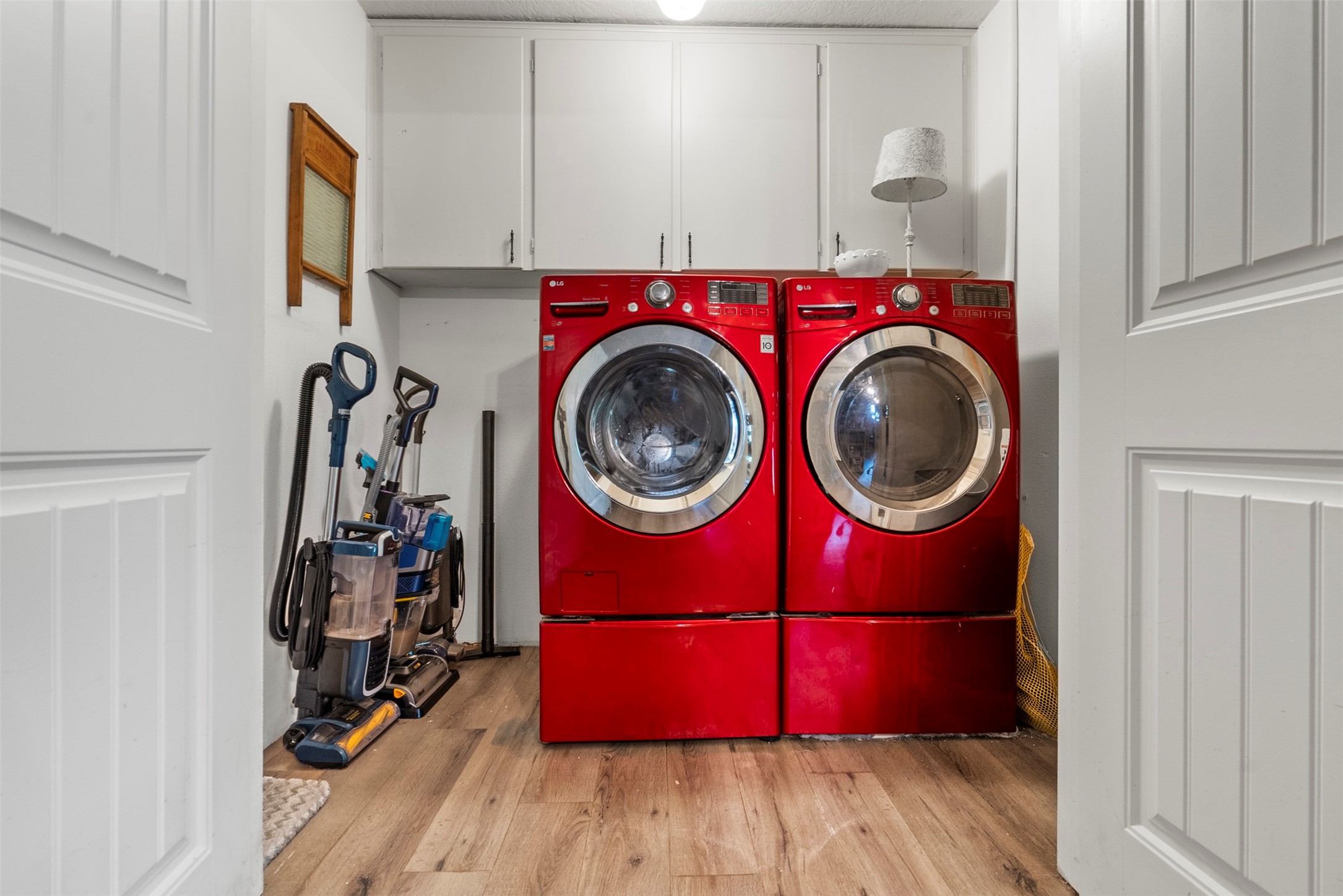 5211 Ghinaudo Road Hitchcock, TX 77563 - Photo 26 of 34 a utility room with dryer and washer