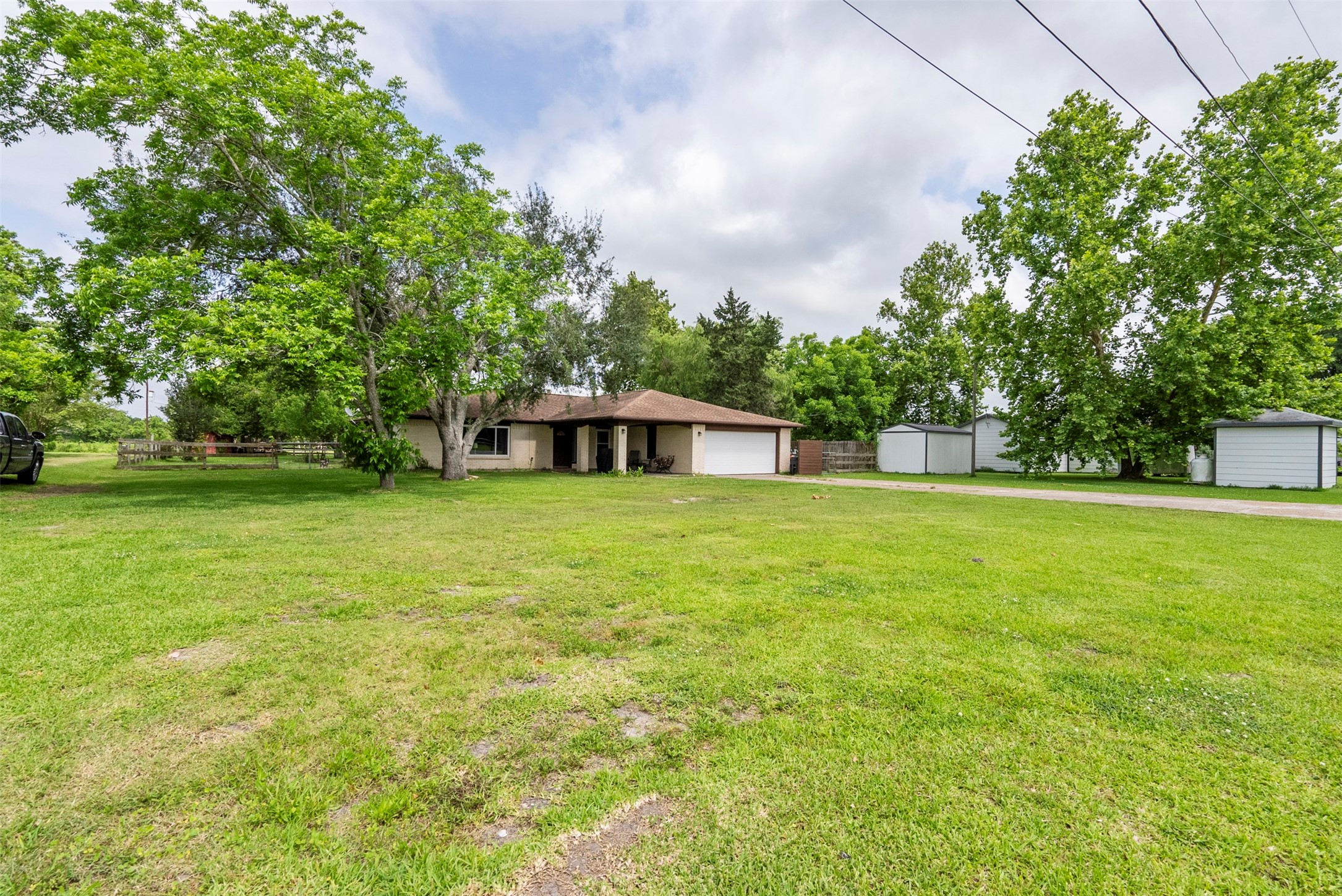 5211 Ghinaudo Road Hitchcock, TX 77563 - Photo 27 of 34 a view of a green field with wooden fence