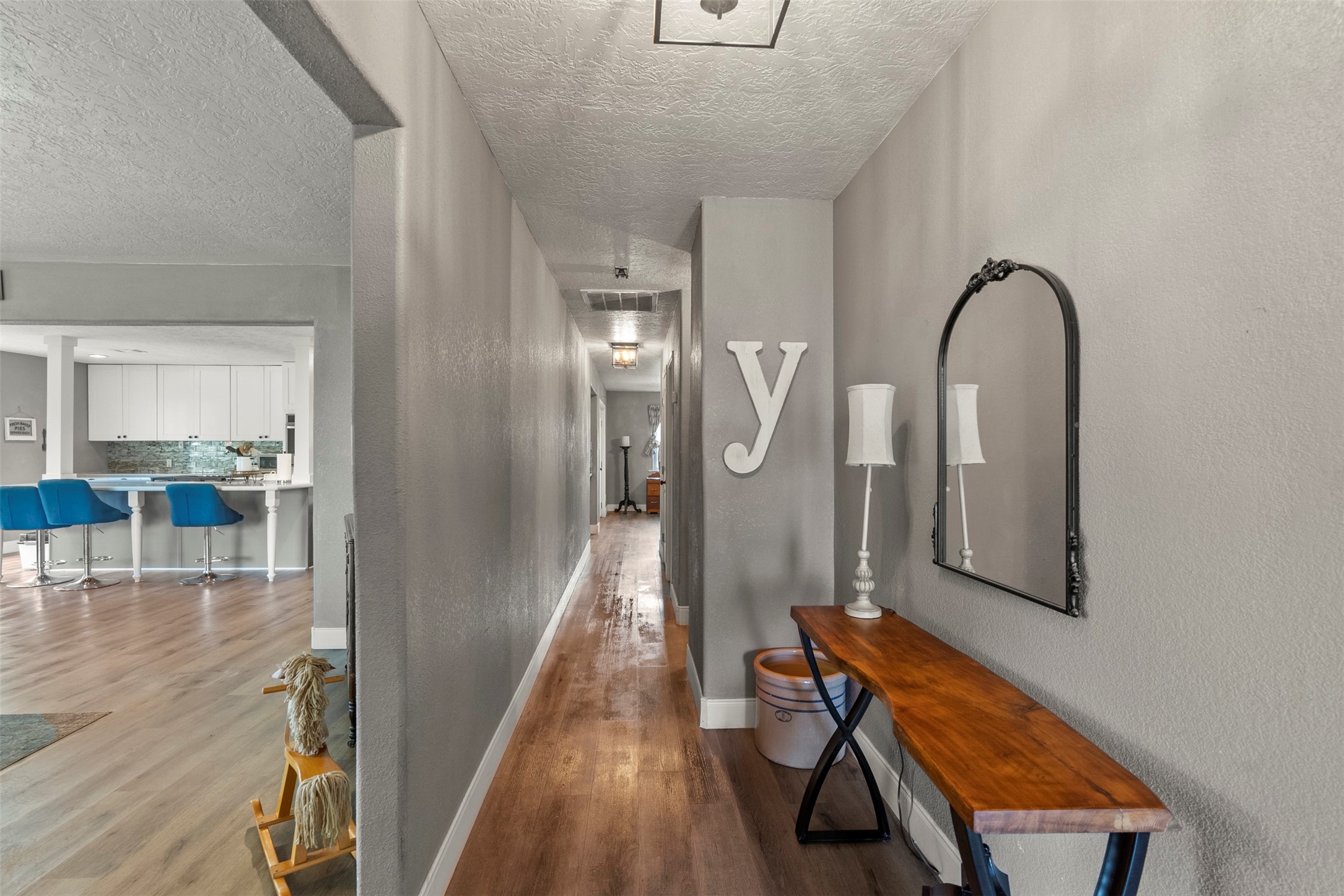 5211 Ghinaudo Road Hitchcock, TX 77563 - Photo 5 of 34 a view of a hardwood floor and staircase