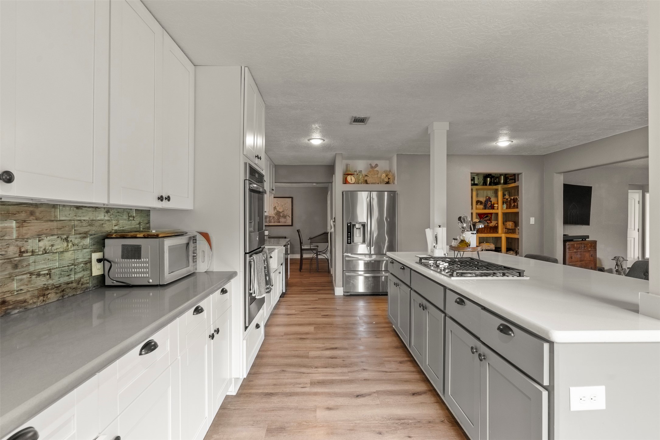 5211 Ghinaudo Road Hitchcock, TX 77563 - Photo 6 of 34 a large kitchen with stainless steel appliances lots of counter top space