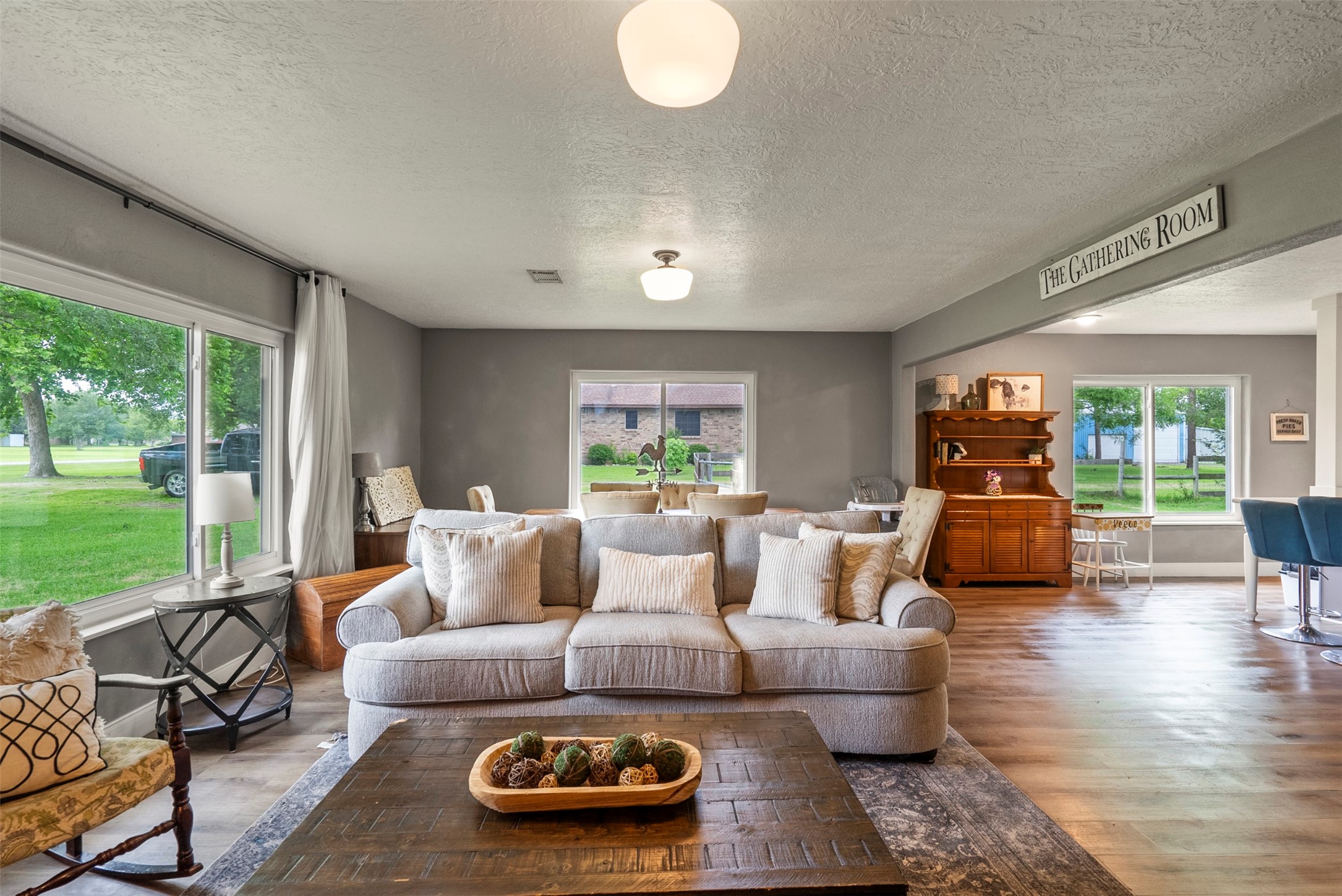 5211 Ghinaudo Road Hitchcock, TX 77563 - Photo 8 of 34 a living room with furniture and a large window