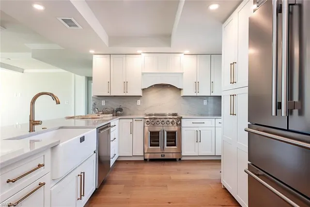 a kitchen with granite countertop a stove and a sink