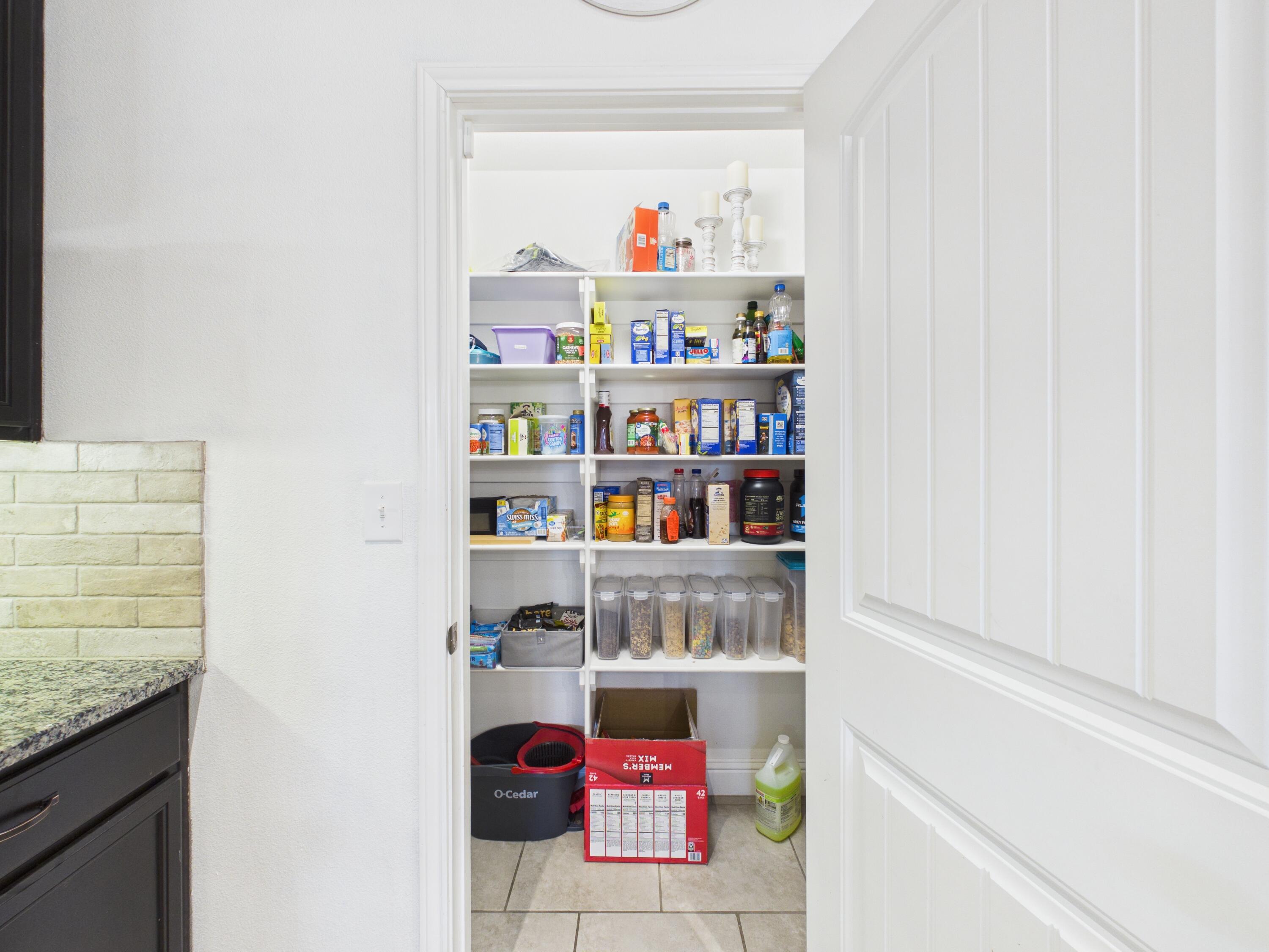 7101 94th Street Lubbock, TX 79424 - Photo 18 of 33 a workspace with furniture and a book shelf