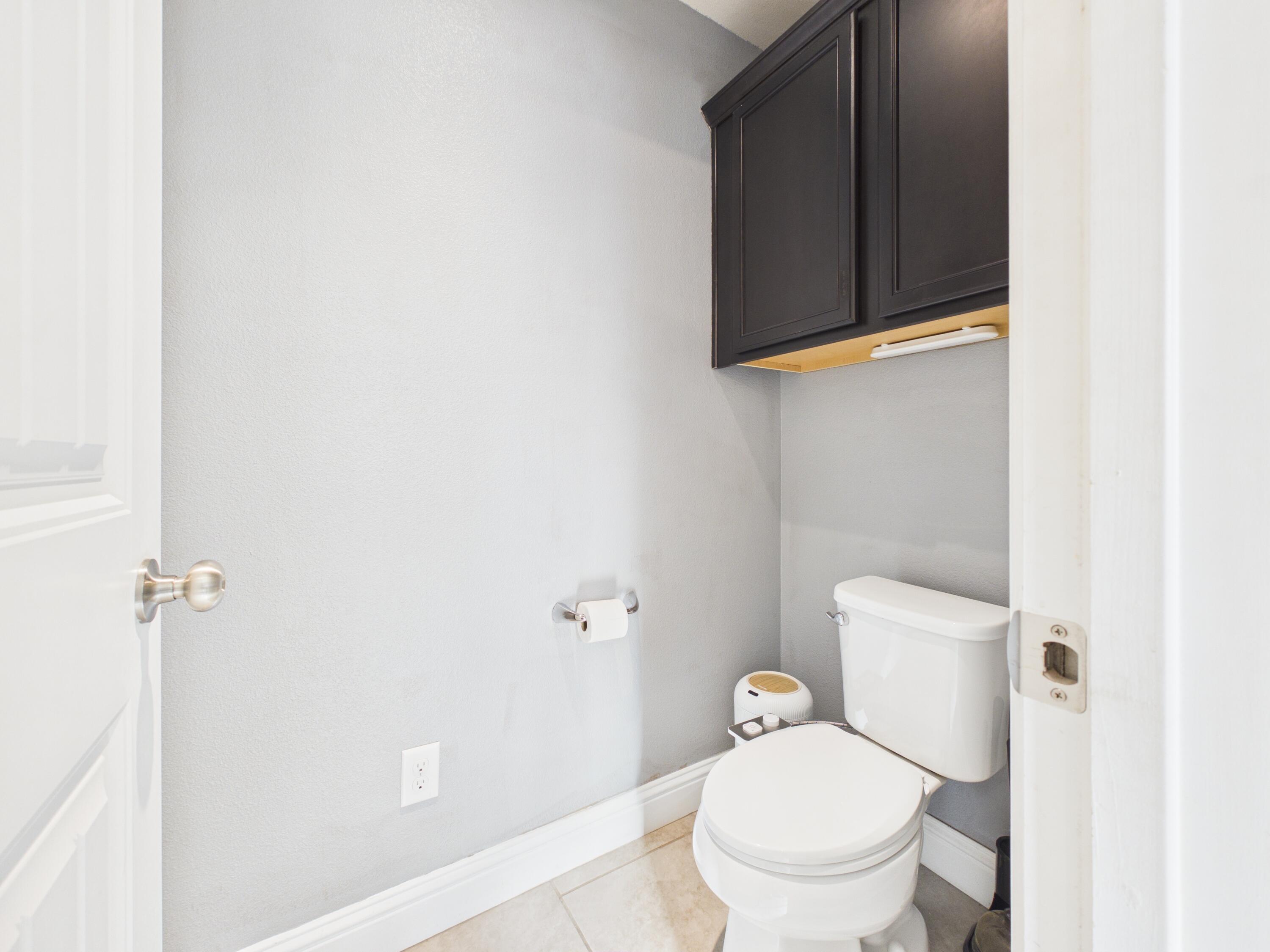 7101 94th Street Lubbock, TX 79424 - Photo 26 of 33 a white toilet sitting next to a shower