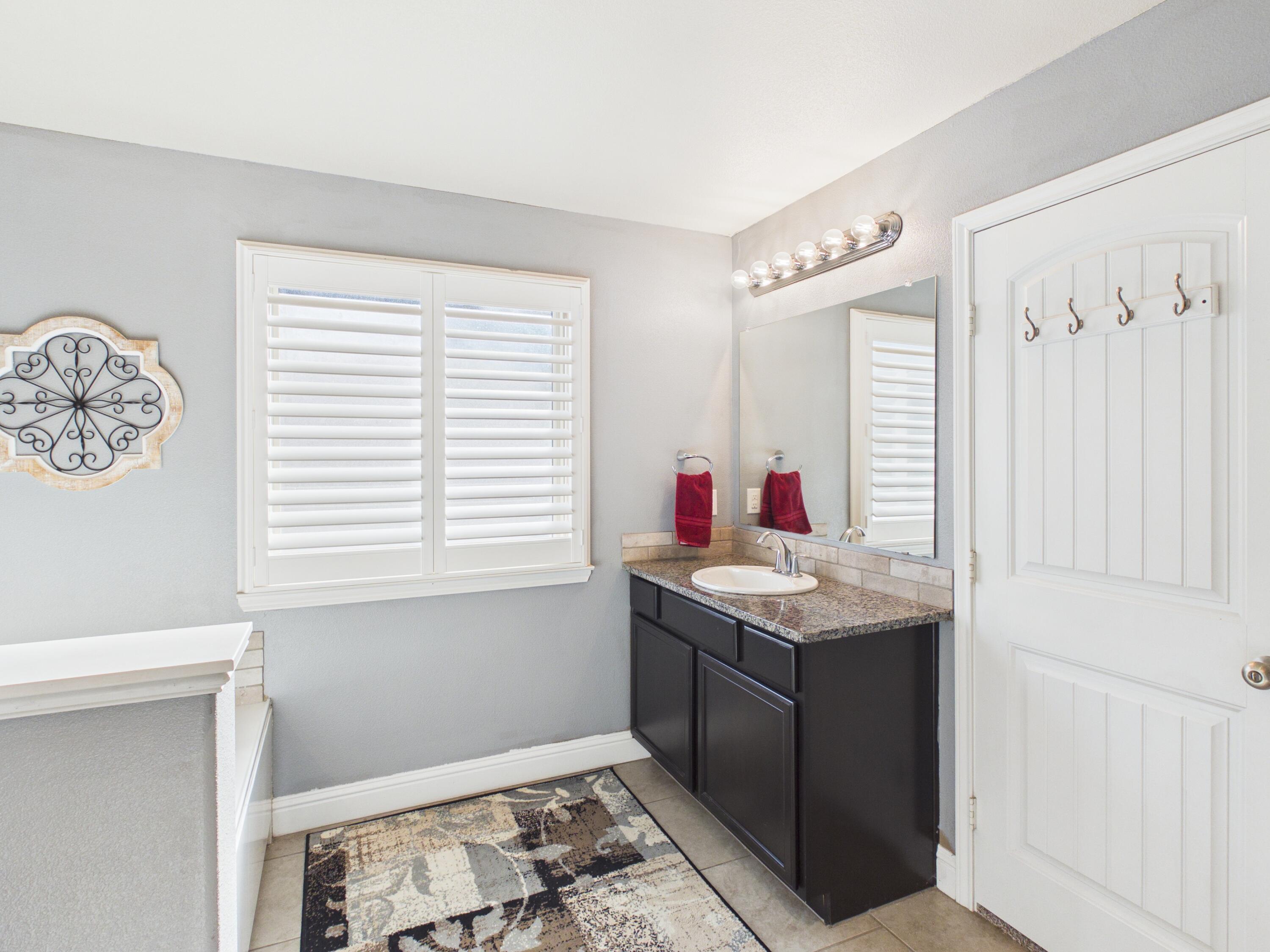 7101 94th Street Lubbock, TX 79424 - Photo 27 of 33 a kitchen with a sink and a window