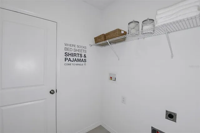 a living room with furniture a mirror and a wooden floor