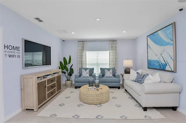 a kitchen with stainless steel appliances kitchen island granite countertop a refrigerator and a stove top oven