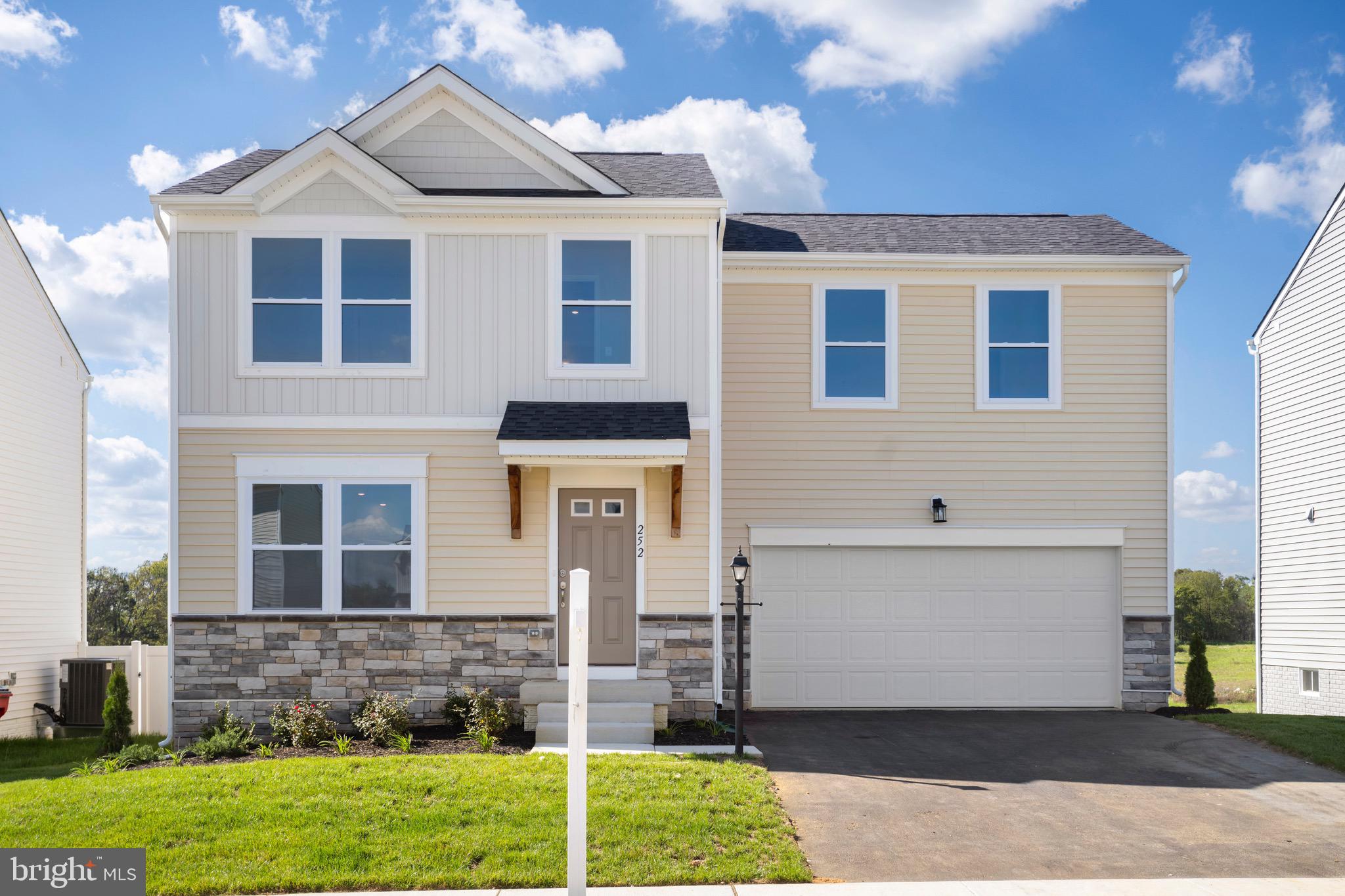 0 Grayling Road Inwood, WV 25428 - Photo 21 of 24 a front view of a house with a yard