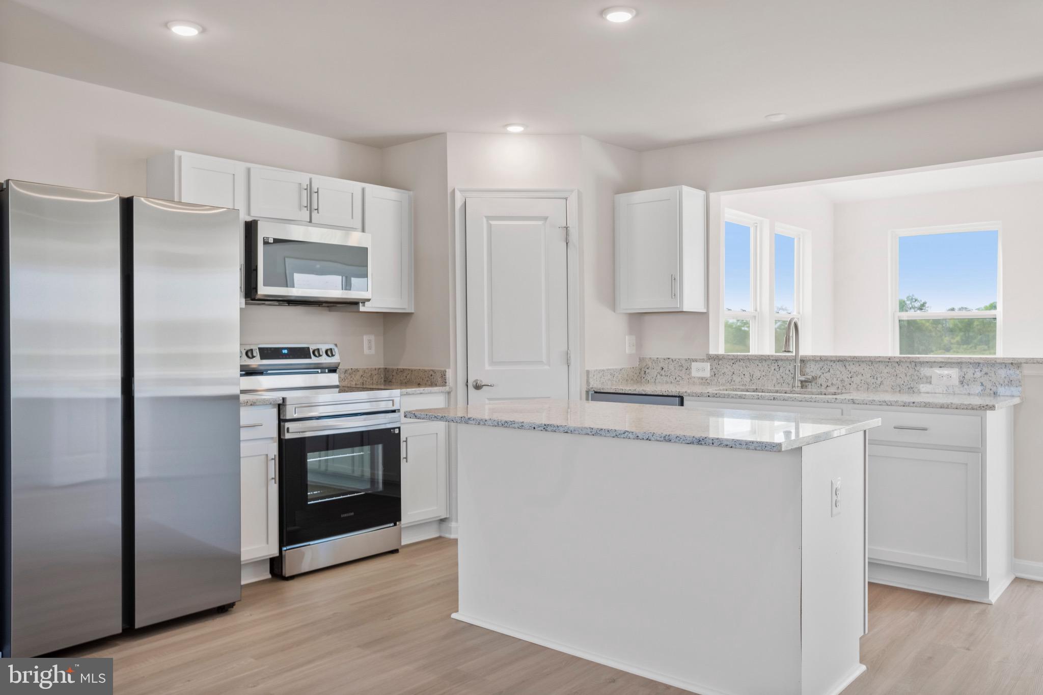 0 Grayling Road Inwood, WV 25428 - Photo 5 of 24 a kitchen with stainless steel appliances granite countertop a sink stove and refrigerator