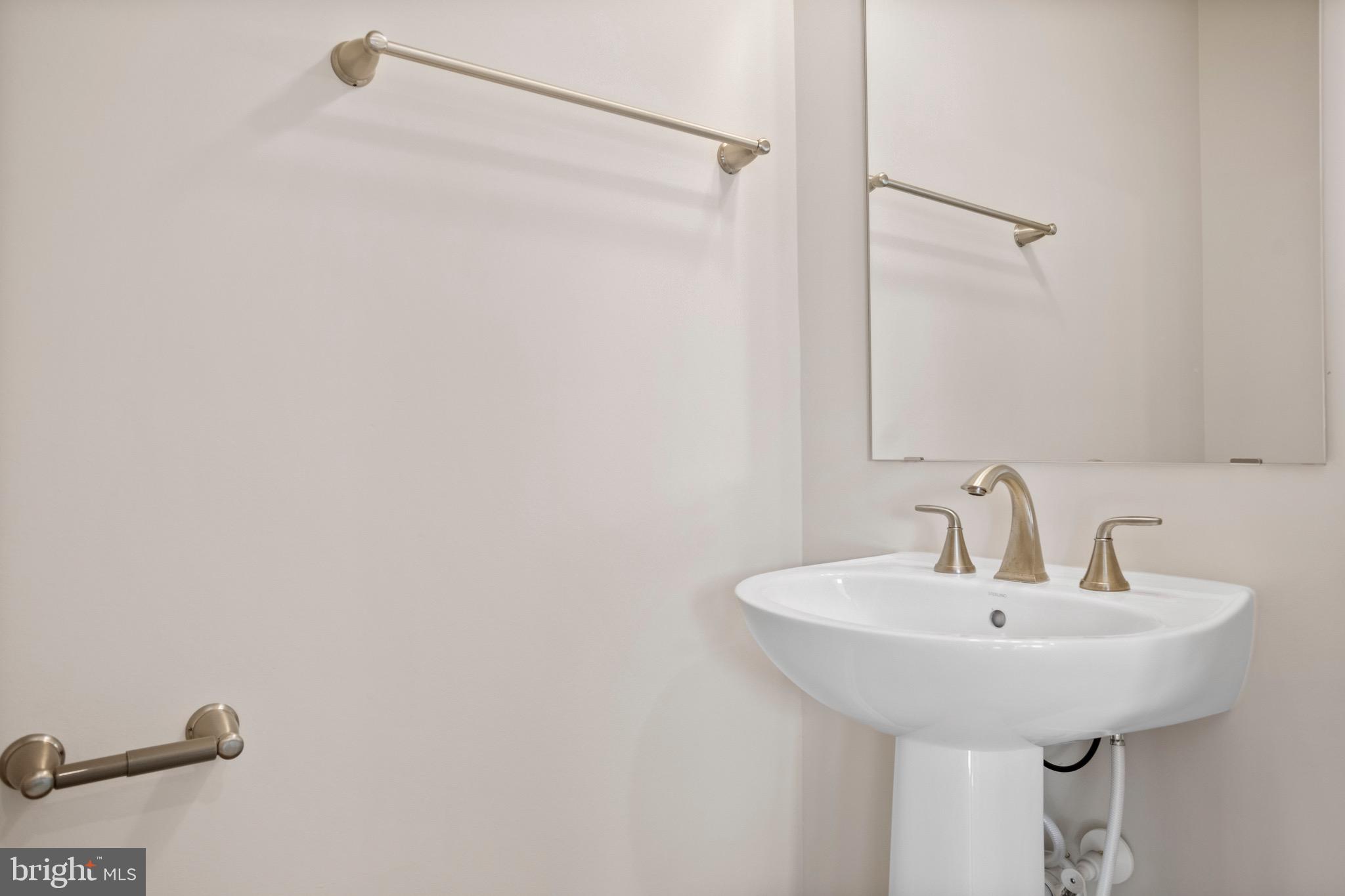 0 Grayling Road Inwood, WV 25428 - Photo 8 of 24 a bathroom with a sink and mirror