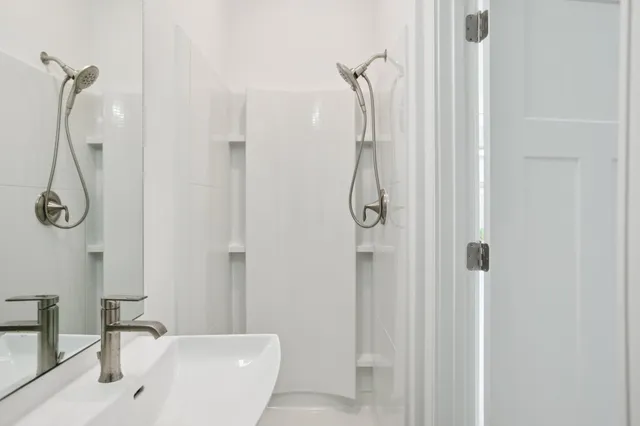 a view of a bathroom with a sink and mirror