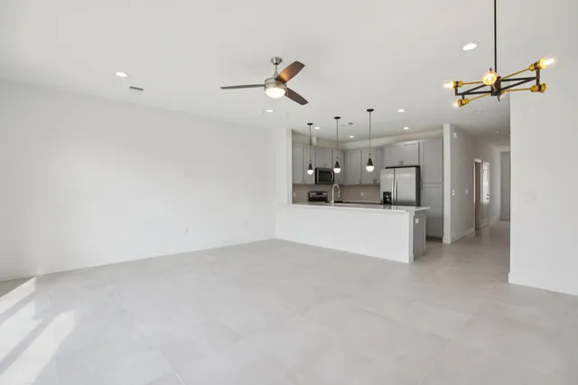 a view of a kitchen with a sink and cabinets