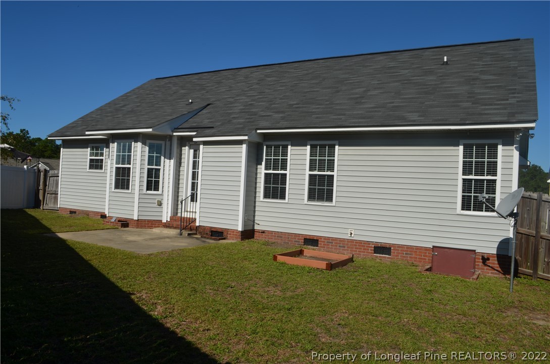 2333 Saltwood Road Fayetteville, NC 28306 - Photo 2 of 2 a front view of a house with a yard