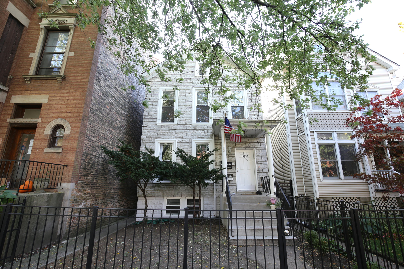a view of a house with brick walls