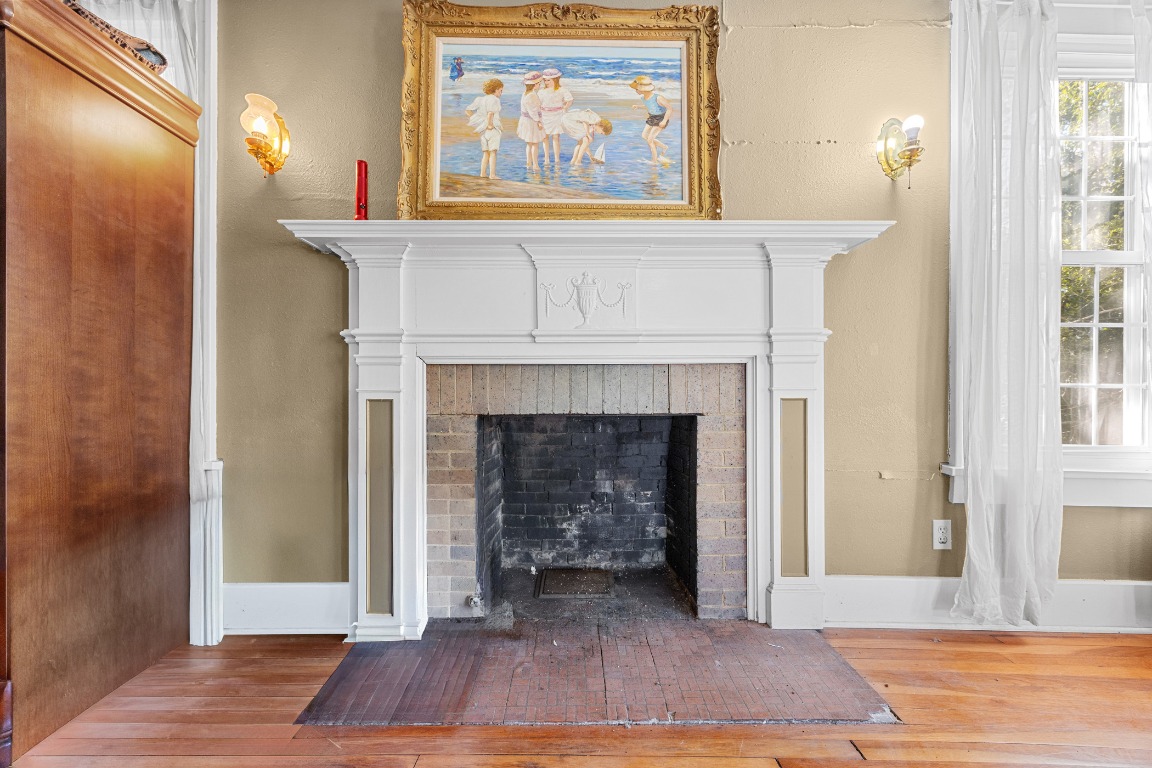 1006 Maple Street Lockhart, TX 78644 - Photo 5 of 32 brick fireplace and wood finished floors