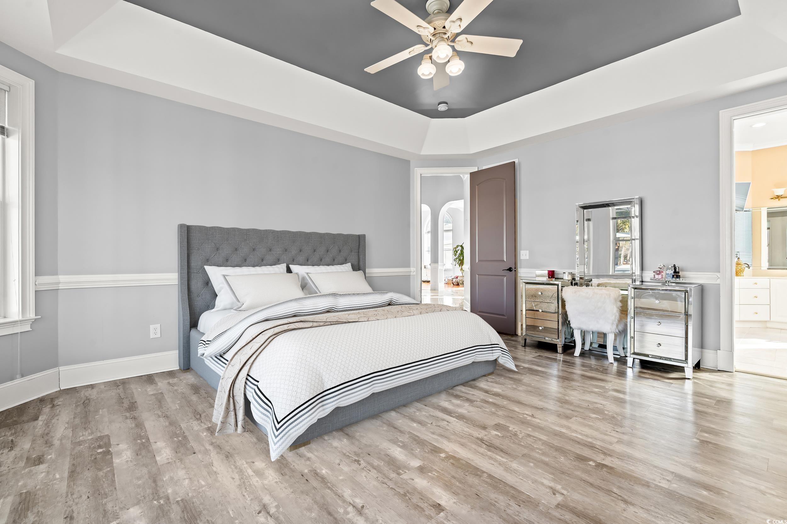 117 Ashley River Road Myrtle Beach, SC 29588 - Photo 16 of 38 Bedroom with ensuite bathroom, light wood-type flo