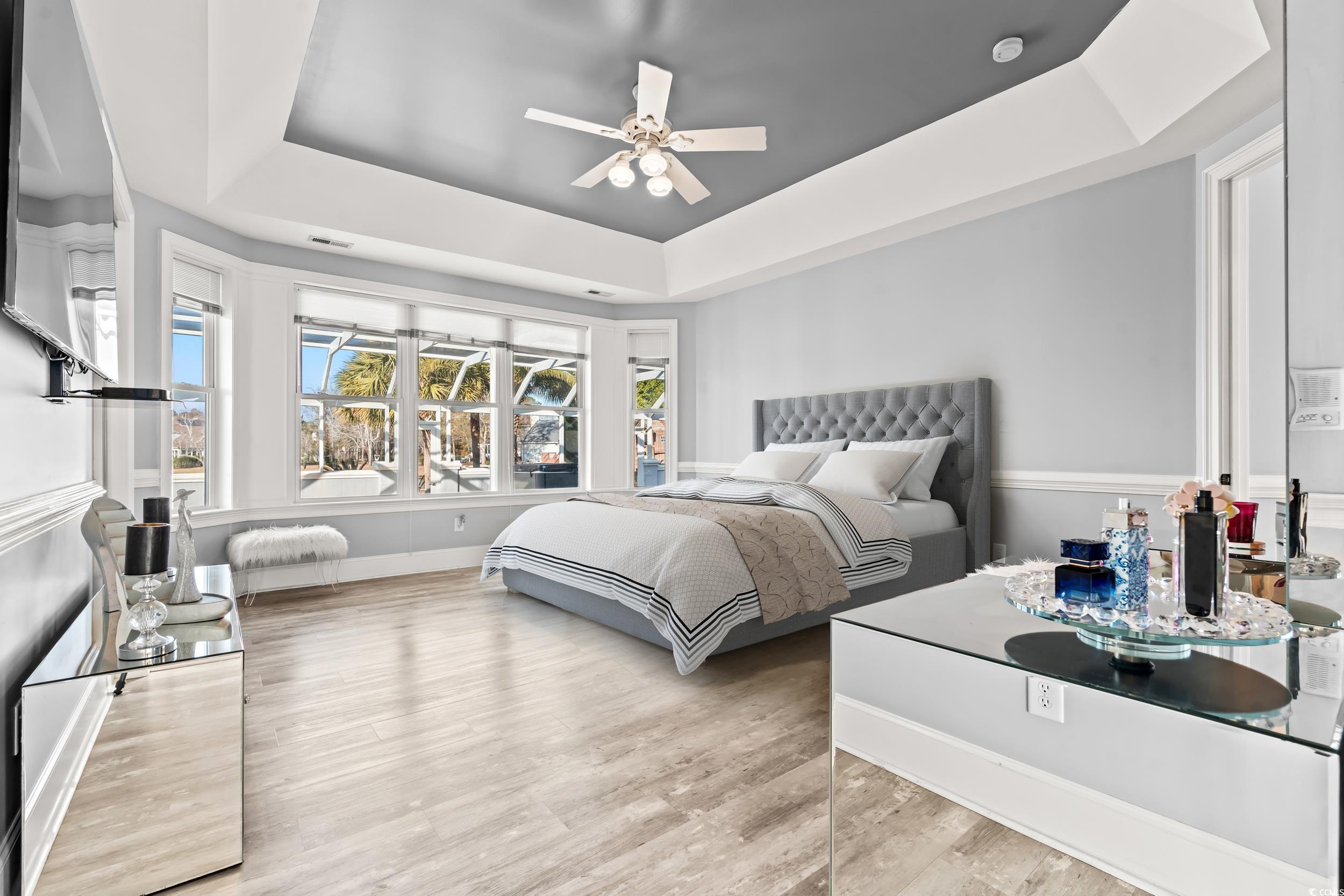 117 Ashley River Road Myrtle Beach, SC 29588 - Photo 17 of 38 Bedroom with ceiling fan, a tray ceiling, and ligh