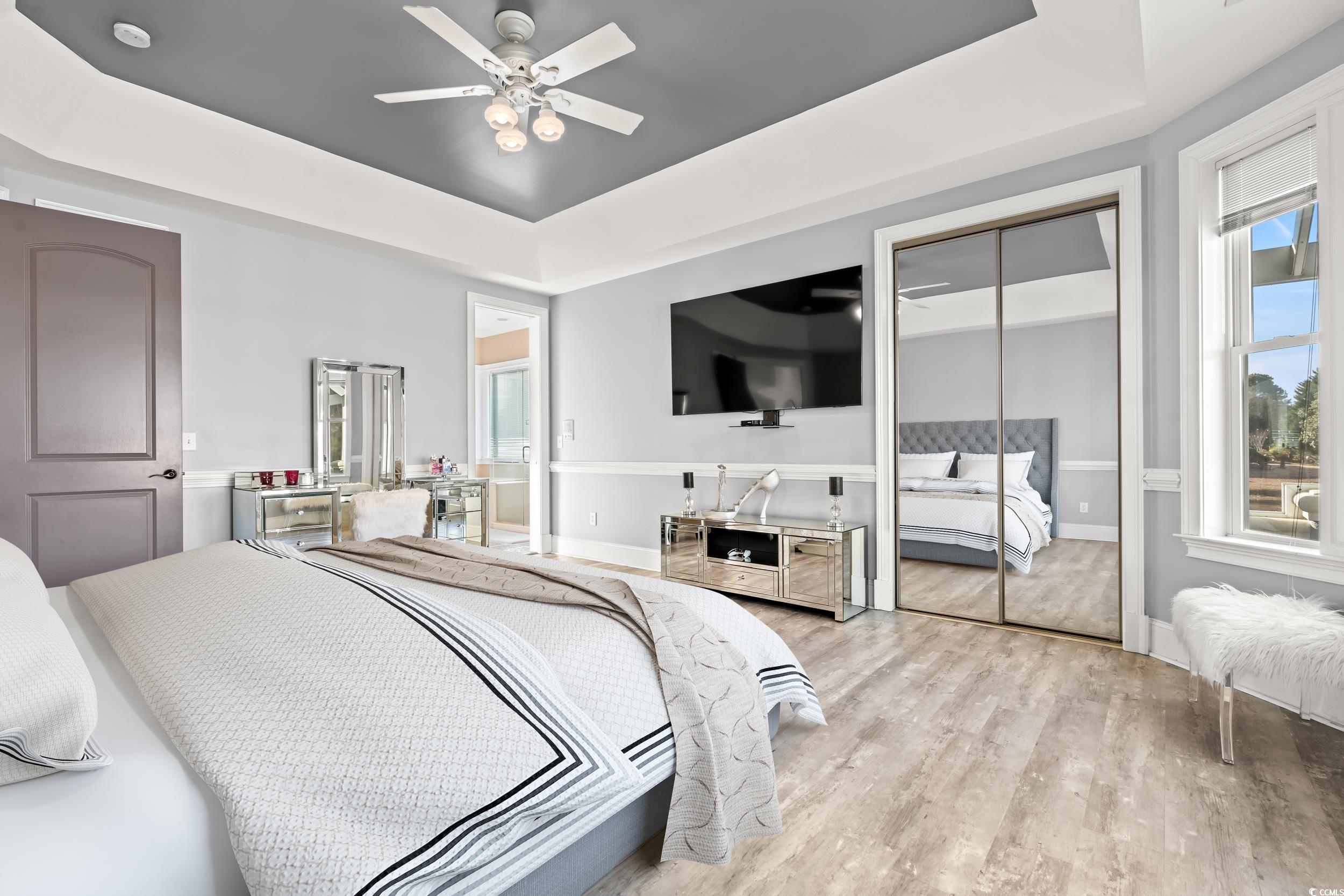117 Ashley River Road Myrtle Beach, SC 29588 - Photo 6 of 38 Bedroom featuring a raised ceiling, ceiling fan, a