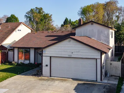 an aerial view of houses with yard