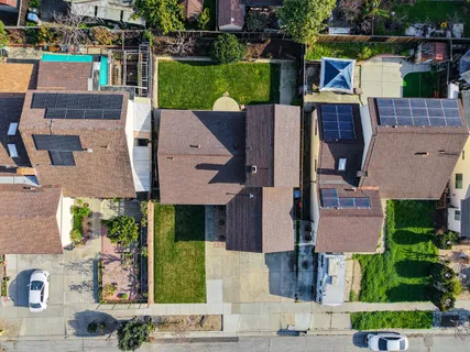 an aerial view of a house with a garden