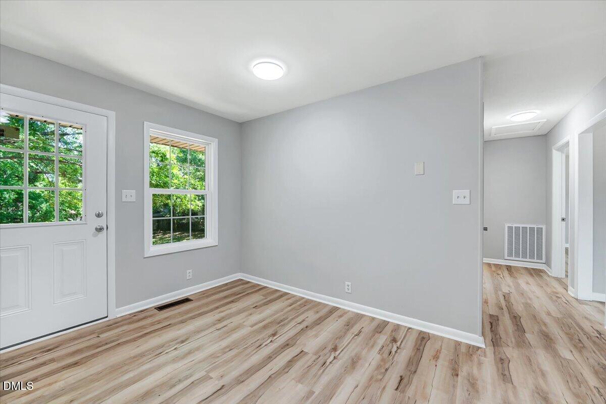 3408 Atlantic Avenue Raleigh, NC 27604 - Photo 13 of 48 wooden floor in an empty room with a window